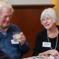 Arlene Chettleburgh talking with two gentlemen at her table